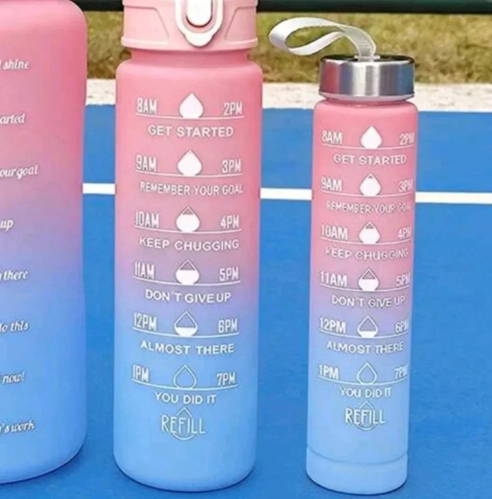 Pink blue water bottle recommended daily consumption and encouraging messages